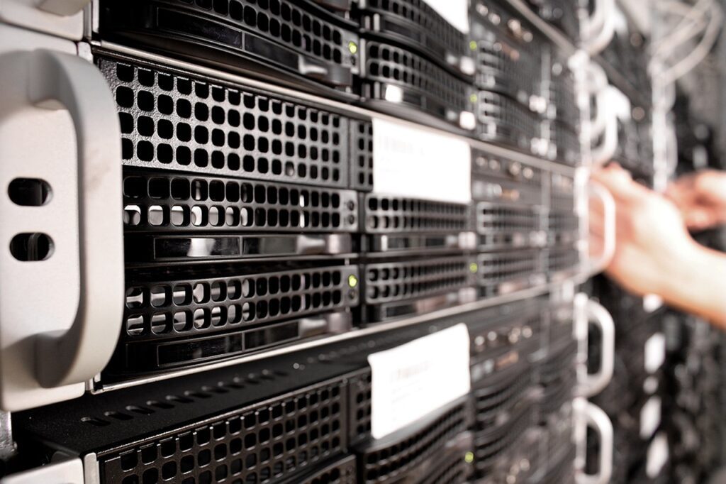 Image of rack mounted servers to represent the offer of managed services.