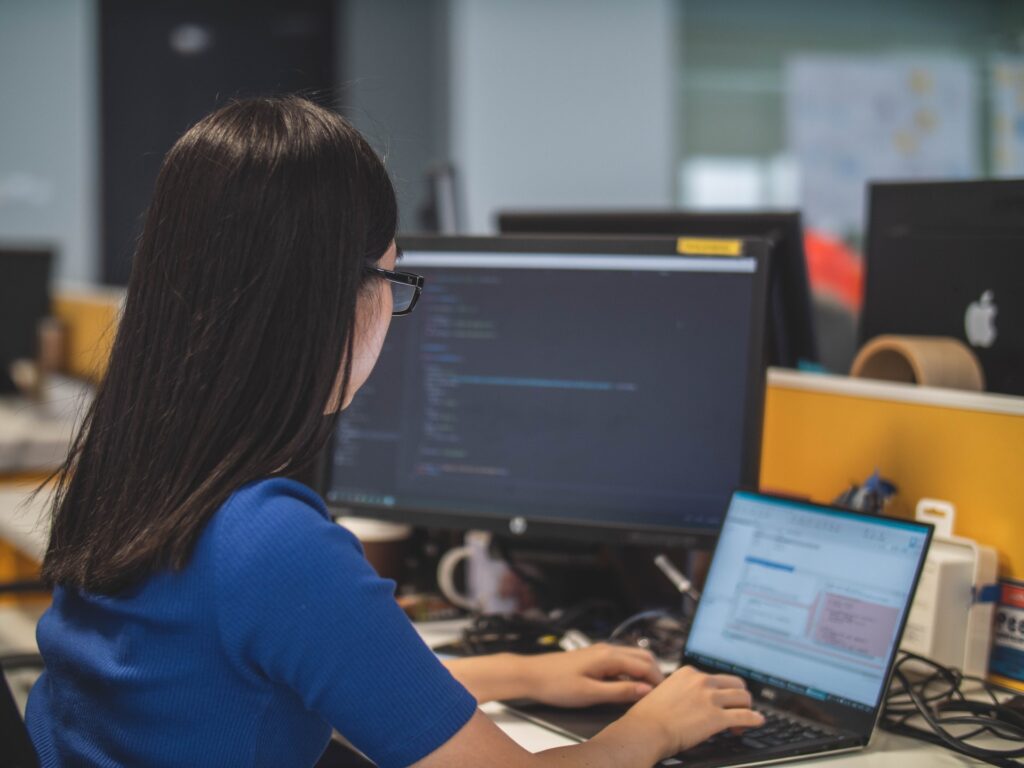 Image of person working at their business workstation for custom
workstation building service.